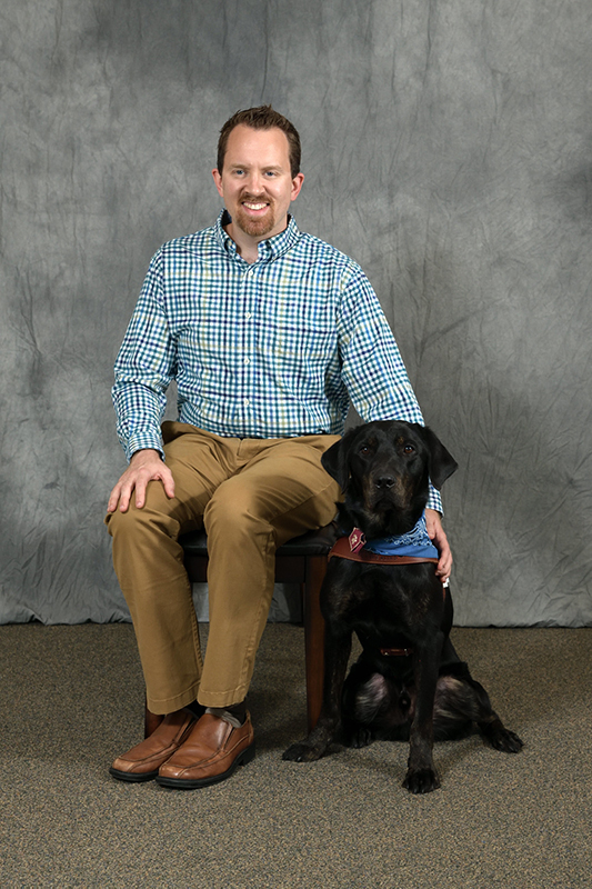 Derek Daniel and guide dog Koa