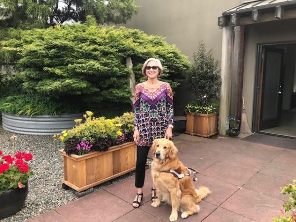 Camille Jassny with her Golden Retriever guide dog Egan.