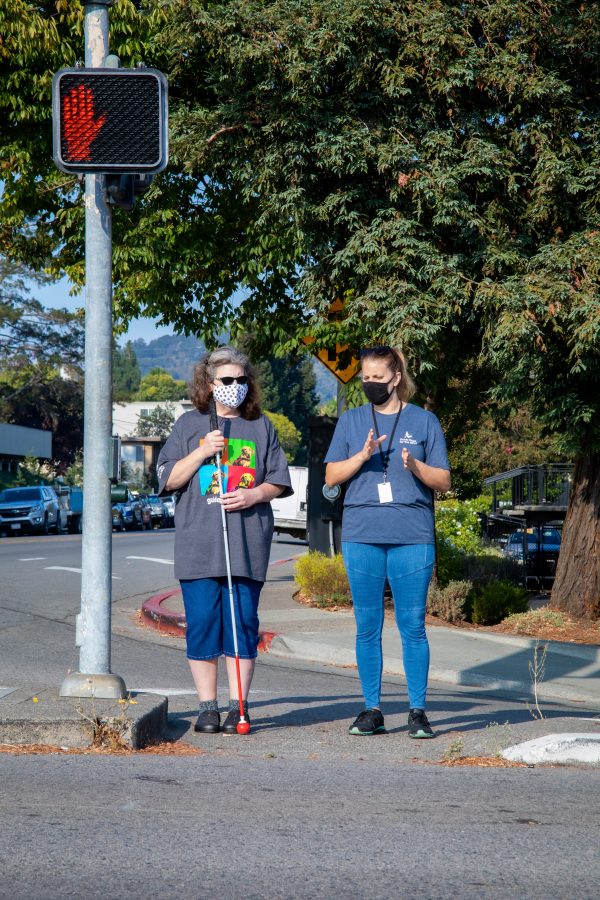 OMI Client Peggy Hargrove receives instruction from OMI specialist, Angela Smith, on crossing a complicated multi-directional intersection.