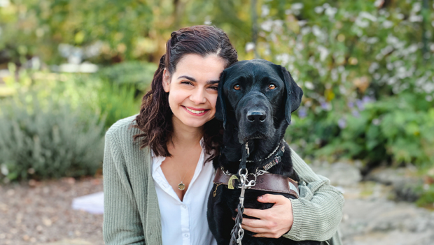Photo of a happy client and their guide dog on the 2023-2024 Guide Dogs for the Blind Calendar