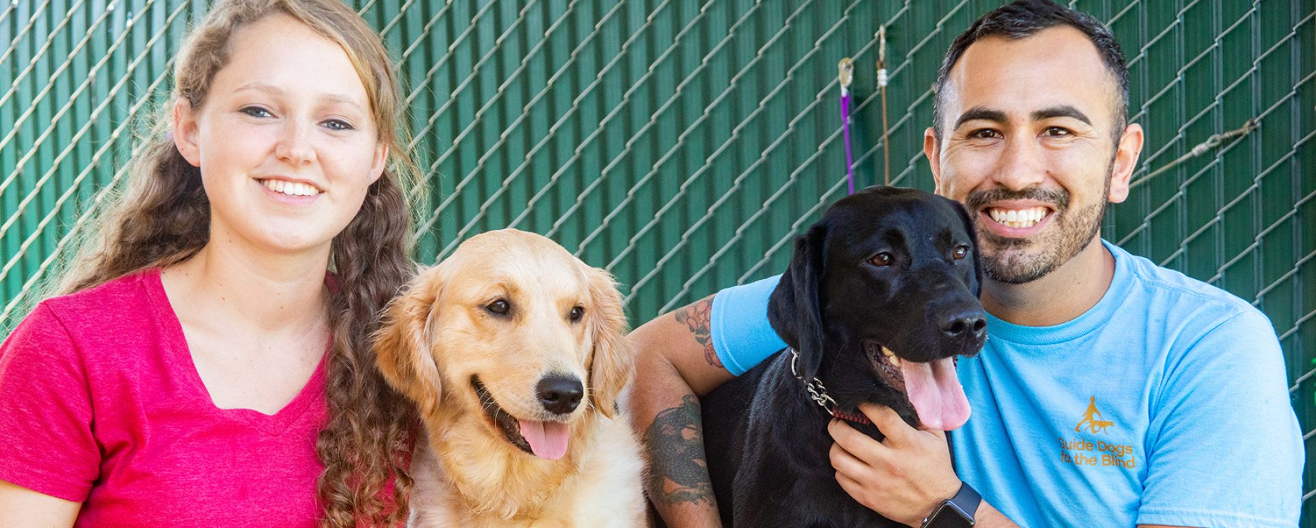 Two happy people and two happy dogs.