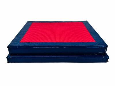 Two stacked books of similar size individually wrapped in duct tape with a piece of yoga mat taped to the top.