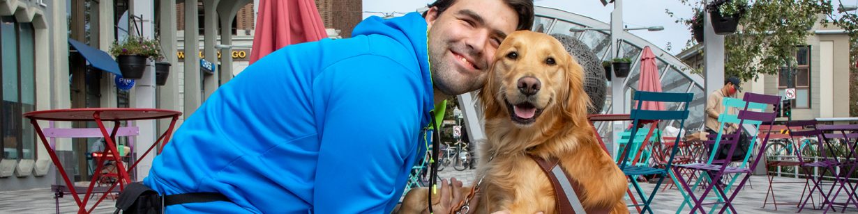 A man and a Golden Retriever guide dog