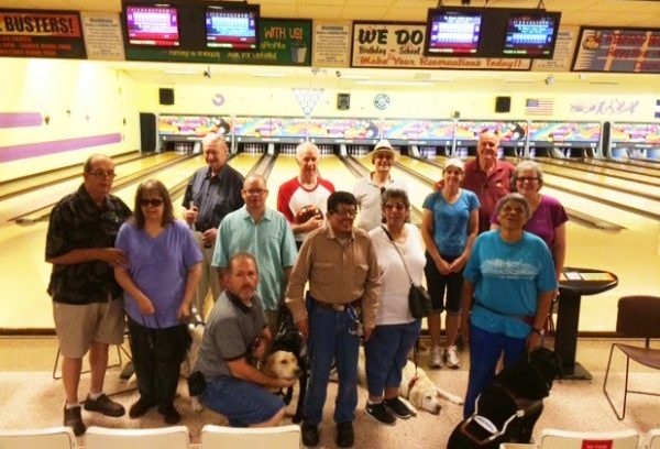 Members of the Rocky Rovers GDB alumni chapter pose with their guides at the bowling alley.