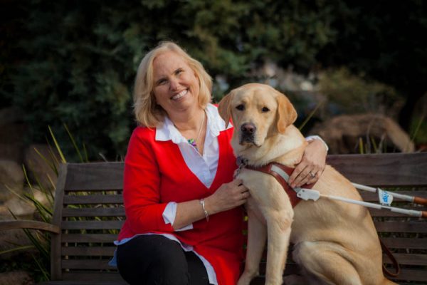 Theresa Stern with her yellow Lab guide dog, Wills.